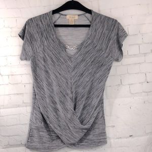 Gray top with metal trim on front